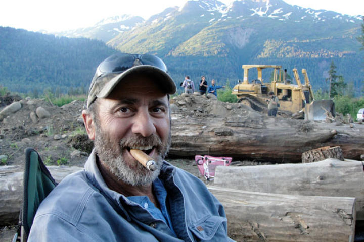 Good-natured Chris Doumitt likes nothing better than a fine cigar with a great view.