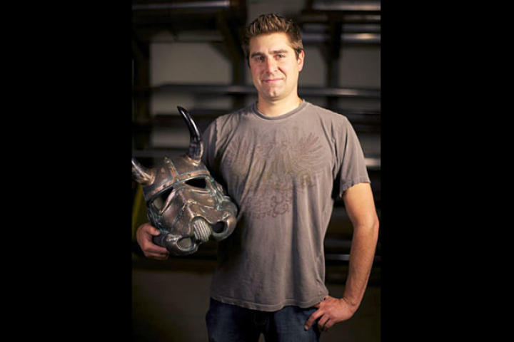 Tory Belleci poses with the customized Stormtrooper helmet he created for the 501ST TK PROJECT. Tory's Viking Helmet is one of more than 50 unique and artistically-modified Stormtrooper helmets that was displayed and auctioned off during