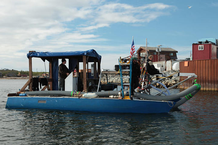 With greenhorn Jason Walker at the helm, the converted catamaran Wild Ranger heads into port.