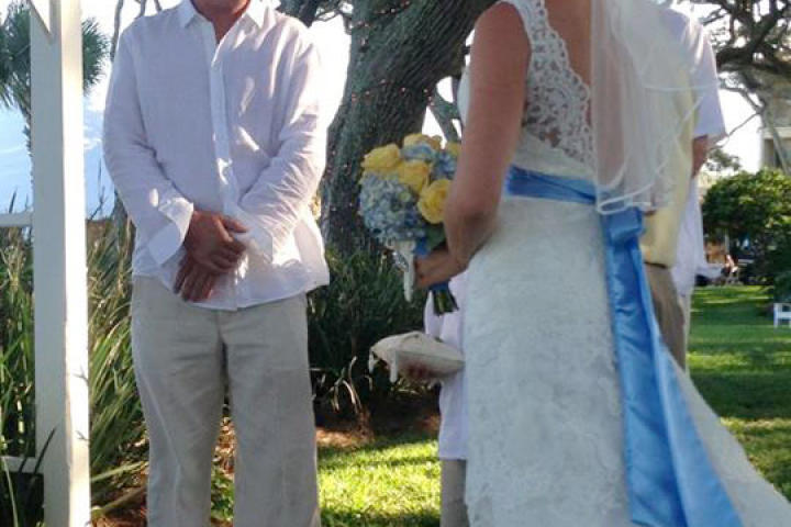 Around her waist, Ansley wears a custom hydrangea-blue sash.