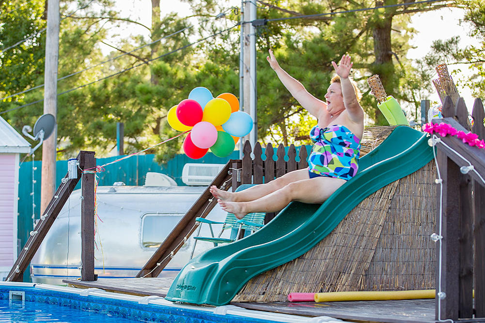 Becky makes a splash on the water slide.