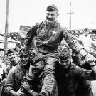 A Hero's Welcome. Colonel Robin Olds is hoisted and paraded on the shoulders of pilots of his 8th Tactical Fighter Wing after the successful completion of his 100th combat mission over North Vietnam.