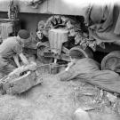 The crew of a Sherman tank of the British Westminster Dragoons repairing damage to one of its suspension units caused by an 88mm anti-tank shell, June 7, 1944, a day after the beginning of the D-Day landings.
Watch video of the
