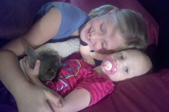 Ysabel and Truely snuggle with Kit Kat.