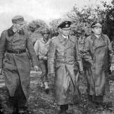 Generalmajor Hans von der Mosel and other German officers surrender to Lt. Col Anthony Miller at Brest, France September 1944.