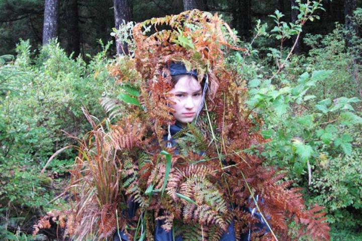 Snowbird is known in her family as being an excellent hunter and bear fisher. Here she is at a young age dressed in camouflage in preparation for a hunt.