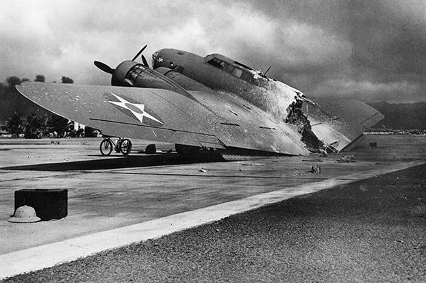 This B-17 was flying into Hickam Field, Oahu, Hawaii as the surprise attack on Pearl Harbor was underway. Hit during her approach, the plane fell apart as it landed, but the crew survived.