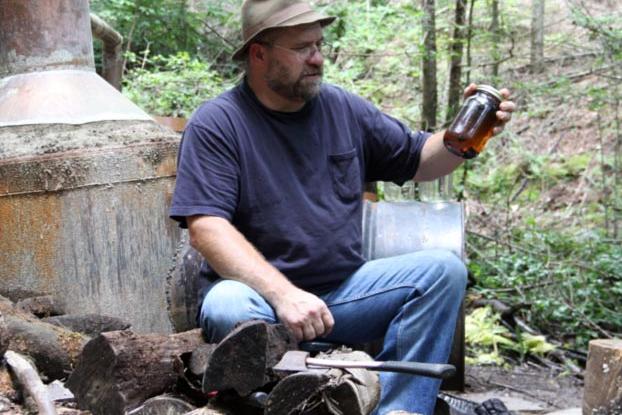 Jeff takes a moment to sit down next to his still.