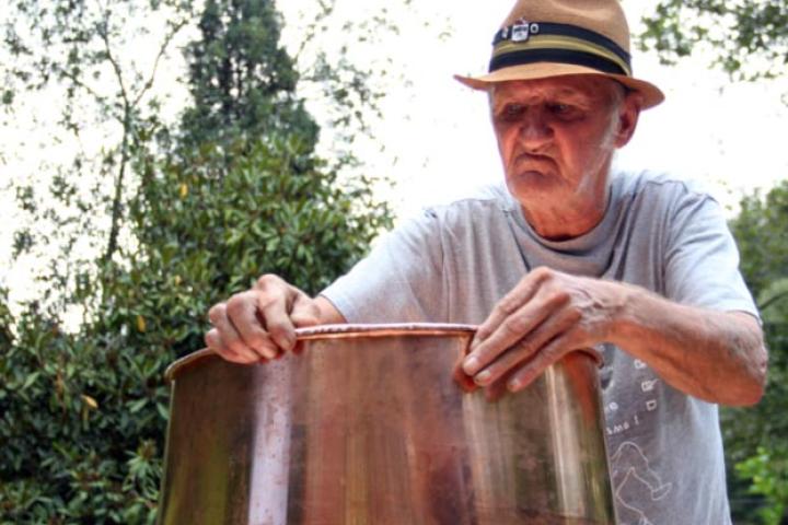 Jim Tom builds a traditional copper still.