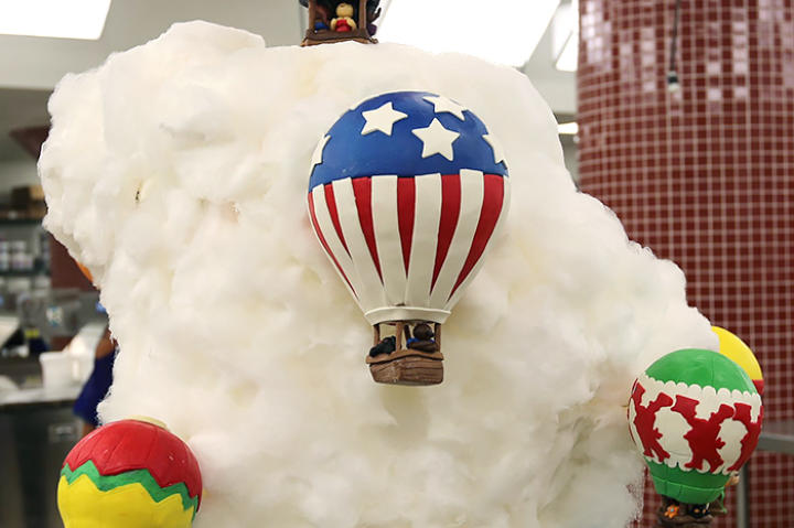 What: Marble pound cake with vanilla buttercream. The cake was covered in fondant and cotton candy. Why it's Special: It has to be small enough to fit inside of a hot air balloon, as Buddy will deliver it to the event in a balloon!
