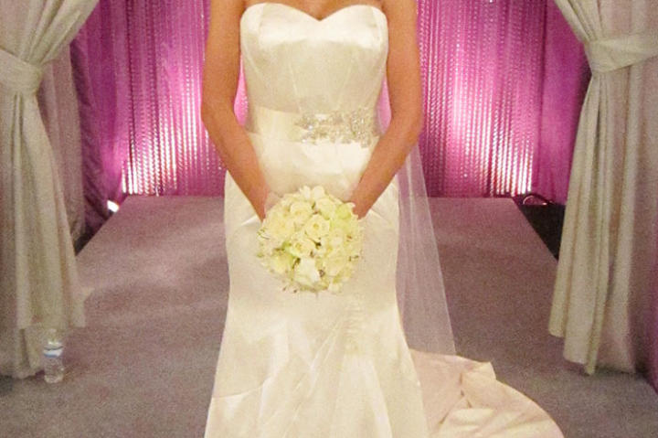 A satin fit and flare gown with sweetheart neckline is a classic choice.