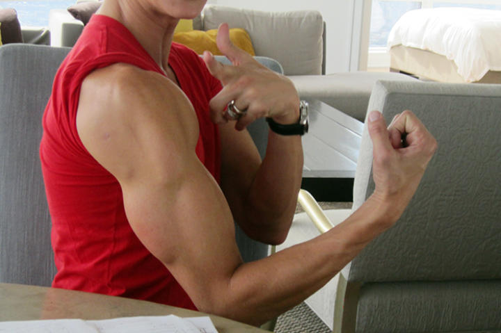 Justin shows off the implants in his arms.