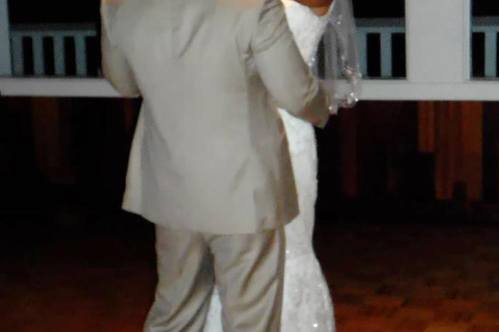 Karina beams on the dance floor at her wedding.