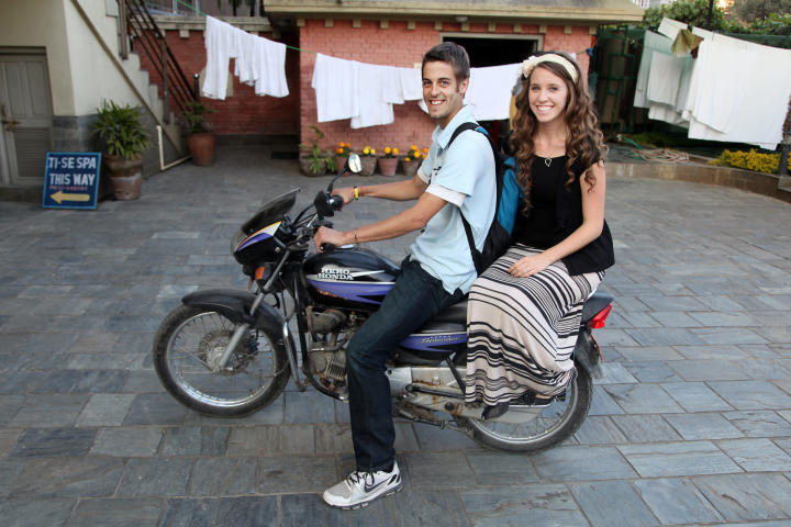 Derick gives Jill a lift on his motorbike.