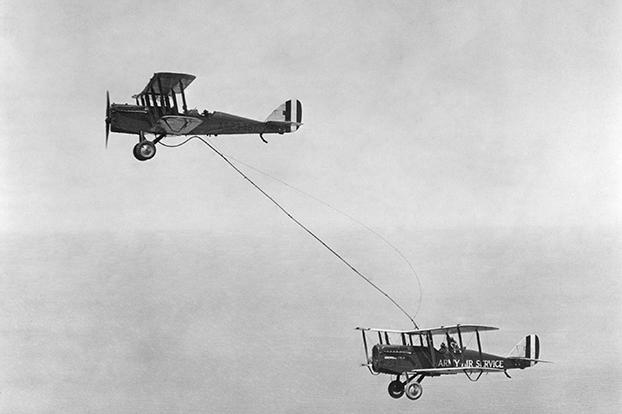 An image of the first aerial refueling performed by Captain Lowell H. Smith and Lt. John P. Richter on June 27, 1923. The DH-4B biplane remained in the air for 37 hours over San Diego, California.