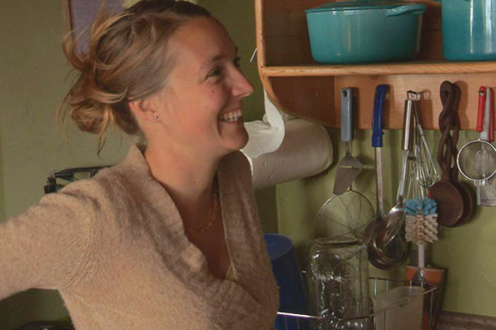Eve smiles at Eivin after a successful first test of running water in their home.