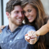 She gives us a close-up view of her sparkly engagement ring and looks like she couldn't be happier!