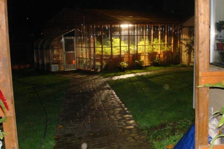 I have taken about a 100 pictures of our greenhouse, but only this one at night. It's also the only one that shows these spirits. The closest one I believe is my dad, he passed on 4/28/10, just two days before my wedding. The 2nd I believe to be my ex-husband (my daughter's dad) who killed himself on 8/2/10, when my daughter was 16. The 3rd one in the back, I believe is my grandfather, who passed away in 1985, 2 days after my daughter turned 2 years old. The last time I was able to communicate with him was on her birthday. I showed him her last picture and told him that it was her birthday. He couldn't talk but he squeezed my hand and let me know he was happy to hear it. From the day of my grandpa's passing, I have always felt that he has kept a watch over Susie and me. But I believe now he is standing back to let the others come forward.
-- Cheryl S.