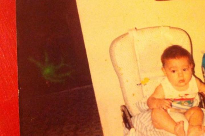 This picture was taken almost 20 years ago at my grandmother's house in Palm Bay, FL. It was an old farm house built in the early 1900s and all of us grandchildren always knew and felt that the place was haunted. We would never sleep upstairs alone and could never prove our suspicions until this photo. This photo has never been altered and we call it “Slimer” as our little joke.
--Kathy M.