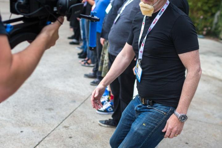 Adam gleefully gathered dozens of fans and Twitter followers outside Comic-Con to dress up as himself with fake beards, hats and glasses.