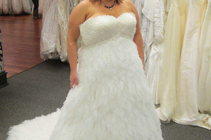 Becky was shopping for "a really cool and different dress" for her vow renewal ceremony. Even though half her entourage scoffed at this "chicken" dress, Becky thought the feathers were really cool and chose it for her event. The Pronovias design retailed for $2,600, but Becky paid just $1,300 at Vows.