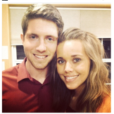 The couple poses for a photo using a favorite Duggar pose --
