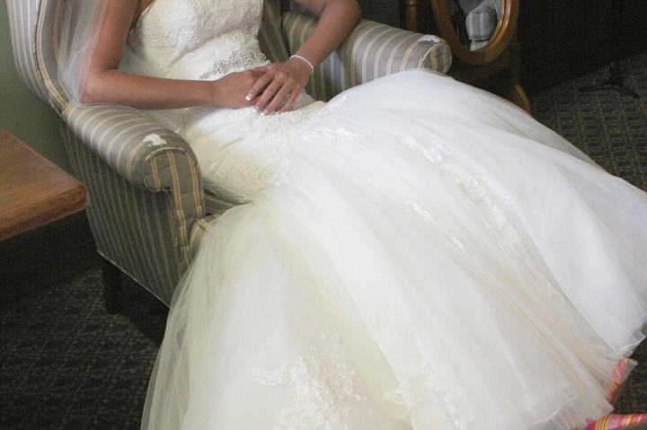 But first the bride gears up for a church ceremony. Laura Ann lounges in her beautiful wedding dress.