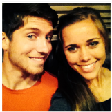 The young couple shows off their big smiles.