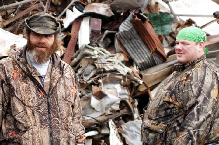 Willy (left) and Buck look for materials they can use to build a monster-trapping cage.