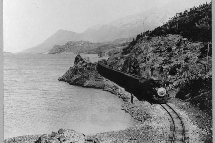 White Pass Railway train on the shores of Bennett Lake, near the Alaskan port of Skagway.