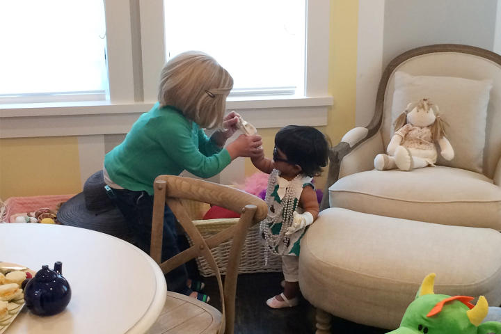 Zoey enjoys playing dress up with Mom!