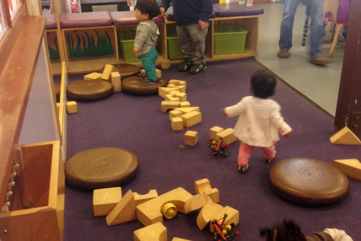 Bill tries to wrangle the kids while they play at the Bay Area Children's Museum.