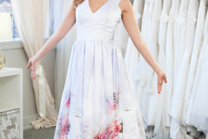Ashley envisioned wearing something sexy, yet casual, for her outdoor wedding. Here, she tries on one of Heidi's most colorful designs.