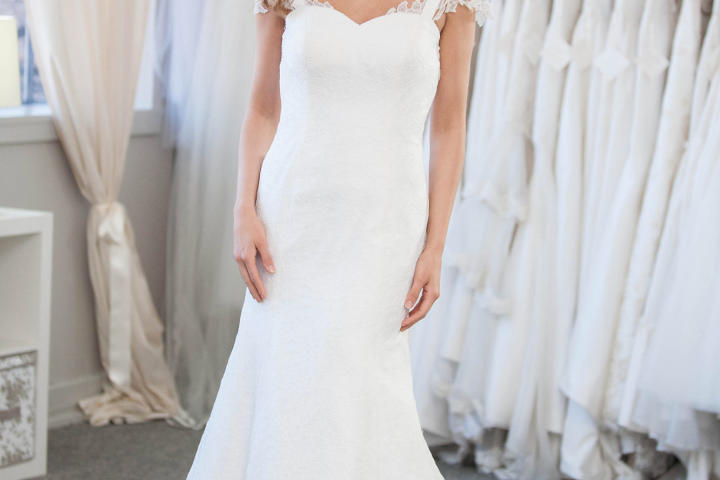 Ashley gets a feel for this trumpet silhouette. The lace cap sleeves are incredibly feminine.