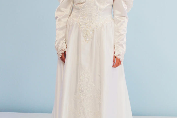 Jessica's other dress option was her mother's 1980s satin gown. Her mother actually paid extra to have sequins sewn on the bodice and train! Jessica hated the optic white color and all the bling; her taste was simpler than this