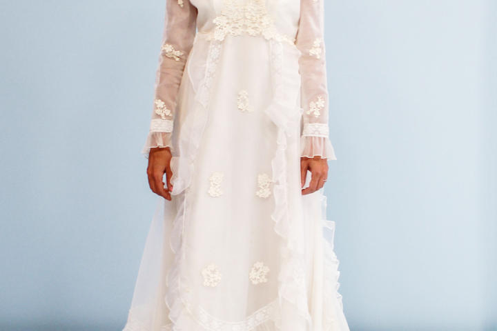 The borrowed dress, courtesy of Amy’s mom, was a little bit milkmaid, a little bit rodeo queen. Amy didn’t like anything about the empire waist A-line gown with long illusion sleeves and lace appliques. What’s more, this dress came with a matching hat!