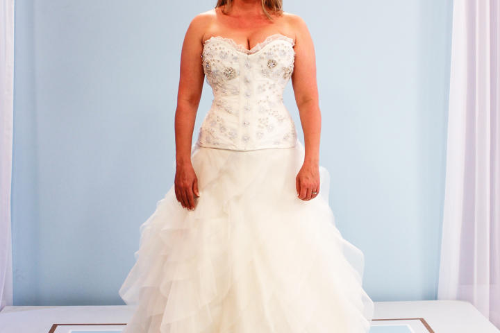 Jennipher couldn't believe this transformation of the borrowed gown! The ruffled skirt and corset back gave her the drama she wanted, and the blue lace on the bodice nodded sweetly at her mother's vintage dress.