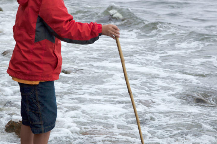 Joel hoping for a good catch in his fishing net.