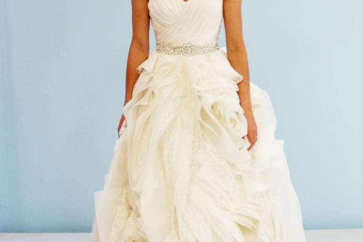Rameneh couldn't believe the transformation of her gown! The bold skirt moved effortlessly, and the delicate ruched sweetheart bodice framed her figure perfectly. Kelly's alterations cost $1,550.