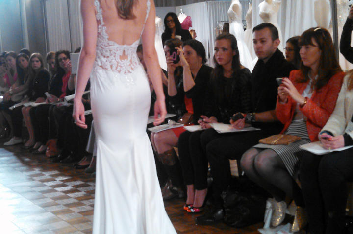 Body-conscious fits and matte fabrics ruled the runway. "These collections were all about the back," Monte says. "Brides have been begging for two things: sexy backs and straps. These gowns offered both. Straps are a must because if you go low in the back, you have to support the front somehow!" This tank dress by Watters has beaded open latticework in the back.