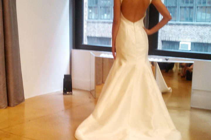 This Judd Waddell gown has a keyhole back. "Heavy silk mikado holds its shape like taffeta or satin," Monte says, "but without the high shine that turns off some brides."