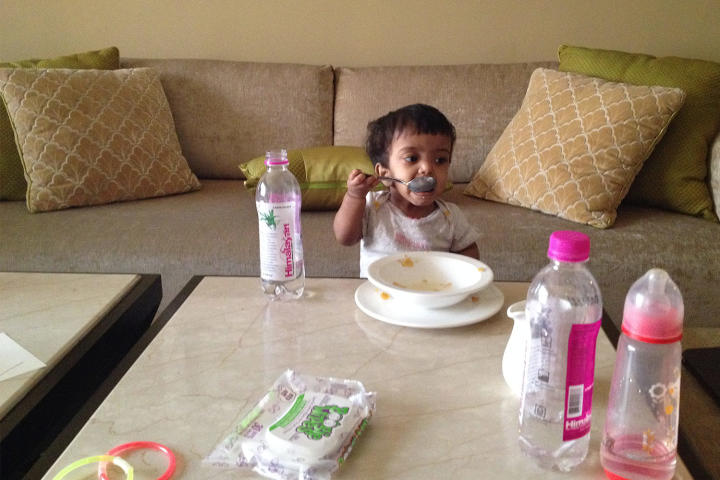 Zoey eats a big breakfast before a day of adventures with her Dad and big brother, Will.
