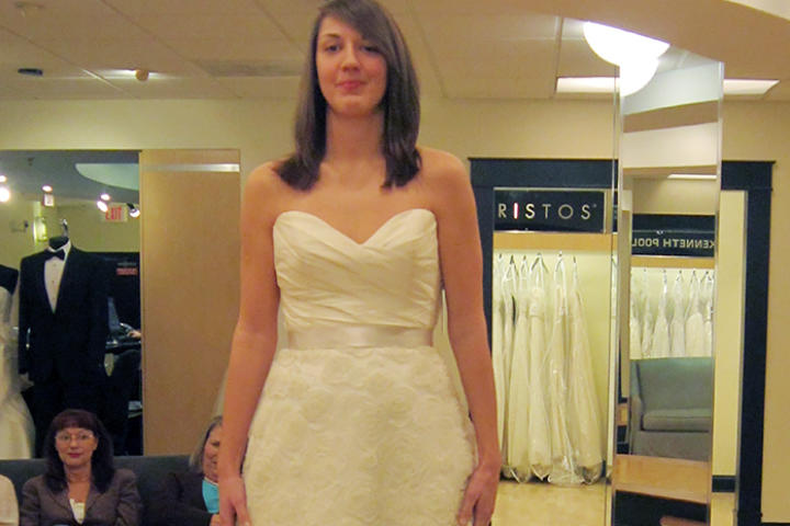 A ruched bodice with sweetheart neckline is ultra feminine when paired with a floral textured skirt.