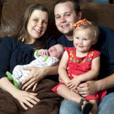 Josh and Anna Duggar with their daughter Mackynzie and their new son.