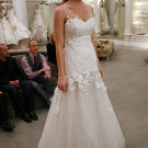 Jackie looked ethereal in this lace A-line gown with floral appliques.