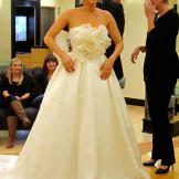 An oversized floral detail makes up the bodice of this couture ball gown; an understated skirt doesn't compete with the flower power up top.