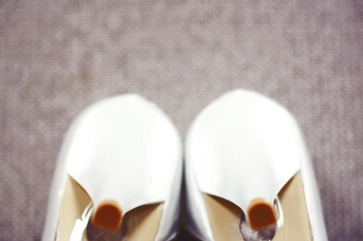 Jenn adds some jeweled details to her wedding shoes.