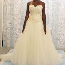 What could be more romantic for a spring or summer bride than this rosette-embellished bodice with sweetheart neckline? A dreamy tulle skirt completes the look.