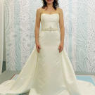 This champagne sheath with straight neckline and dramatic train is the height of elegance.