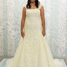 This lace ivory gown with cap sleeves looks great against olive skin.